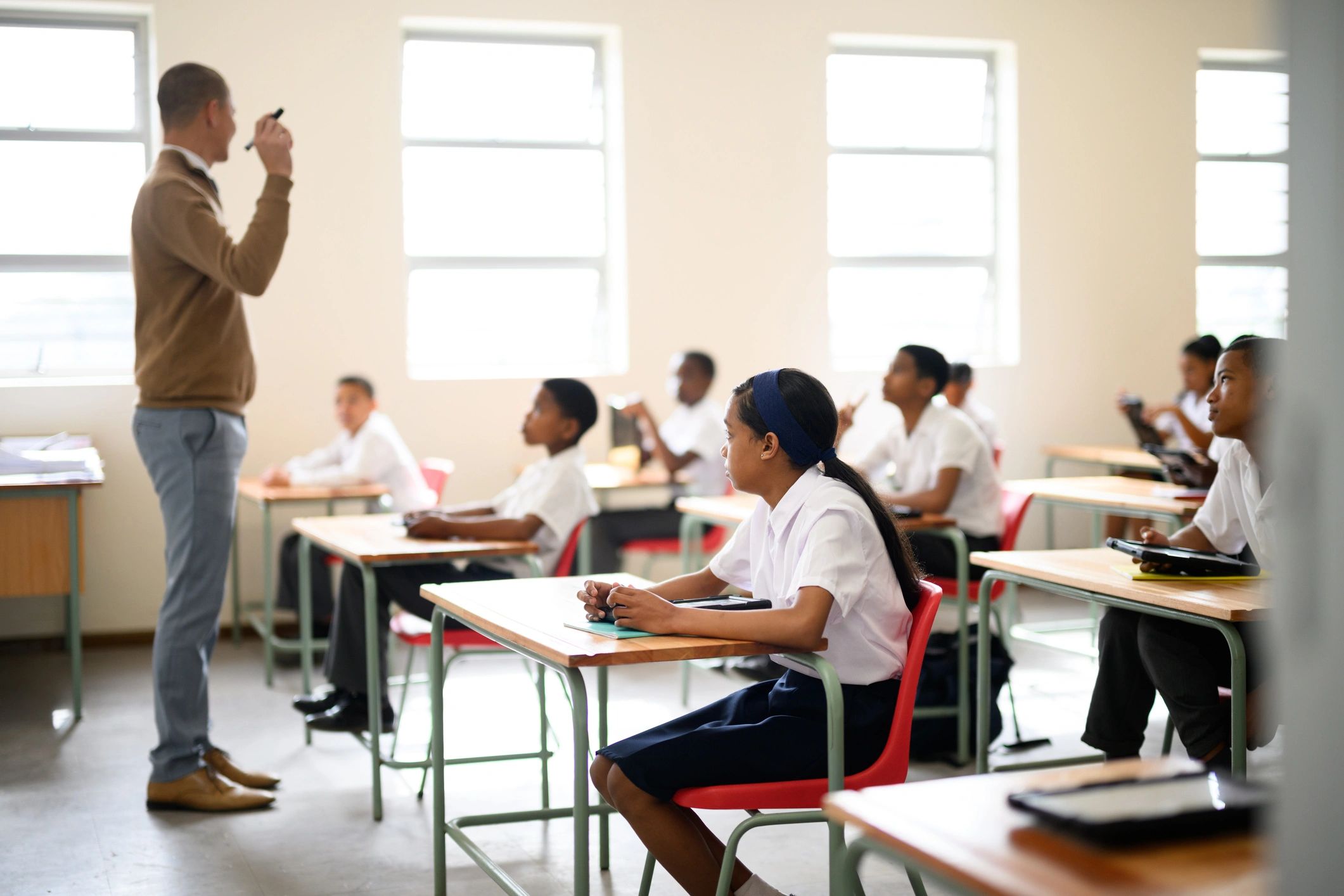 Schoolchildren learning attentively in a classroom