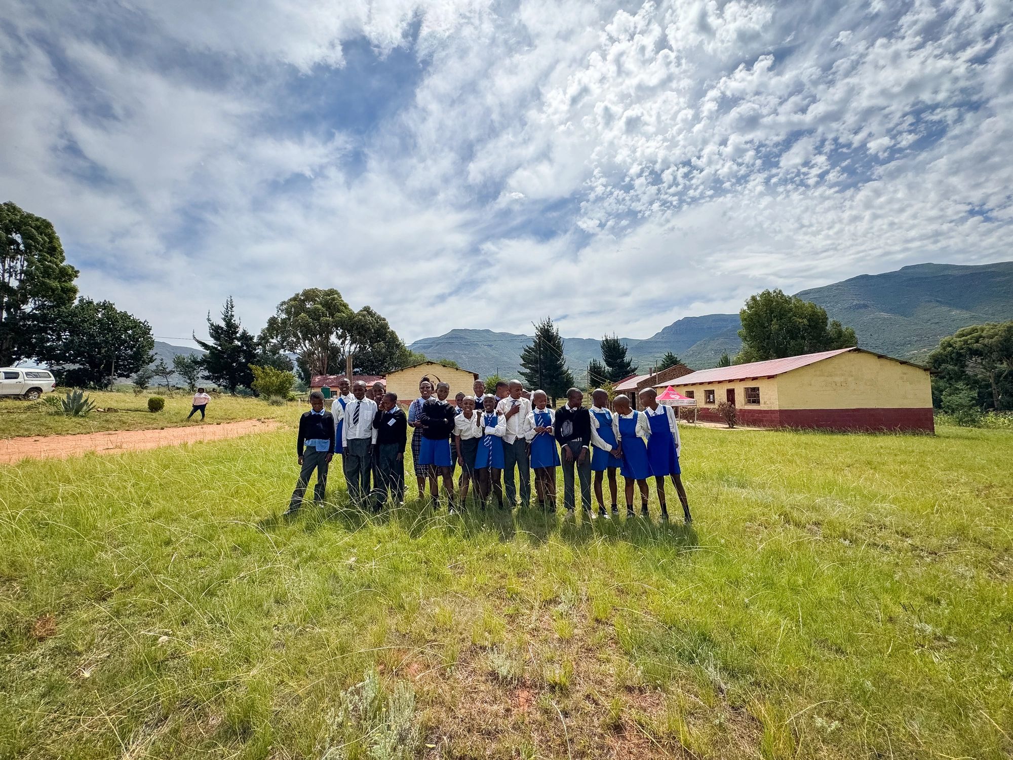 School children gathered outdoors for learning